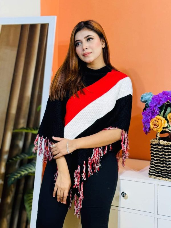 Toropy Premium winter poncho . Latest Designer Clothing for Women's and girl's. No 1 Premium Women's and Girls's Clothing Brand In bangladesh . WOOL Fabrics . Winter Friendly Dress. এই উলের পঞ্চটি শীতের ঠান্ডা থেকে আপনাকে উষ্ণ রাখবে। এর নরম টেক্সচার আপনাকে আরামদায়ক অনুভূতি দেবে। সাধারণ ডিজাইনের এই পঞ্চটি আপনার দৈনন্দিন পোশাকের সাথে সহজেই মানিয়ে নেবে। পঞ্চটি আপনাকে শীতের ফ্যাশন ট্রেন্ডে এগিয়ে রাখবে। এর সুন্দর ডিজাইন আপনাকে বিশেষ করে তুলবে। এই পঞ্চটি শুধু আপনাকে উষ্ণ রাখবে না, আপনার স্টাইলকেও আরও উজ্জ্বল করবে। নরম কাপড় এবং ফ্যাশনেবল ডিজাইন আপনাকে দিনভর আরামদায়ক রাখবে। উষ্ণ, আরামদায়ক, স্টাইলিশ, নরম, হালকা ওজন, দীর্ঘস্থায়ী, ফ্যাশনেবল, ঐতিহ্যবাহী, হাতে বোনা, উল, ক্যাশ্মির, ফ্লিস, এক্রিলিক, শীত, তুষার, ঠান্ডা