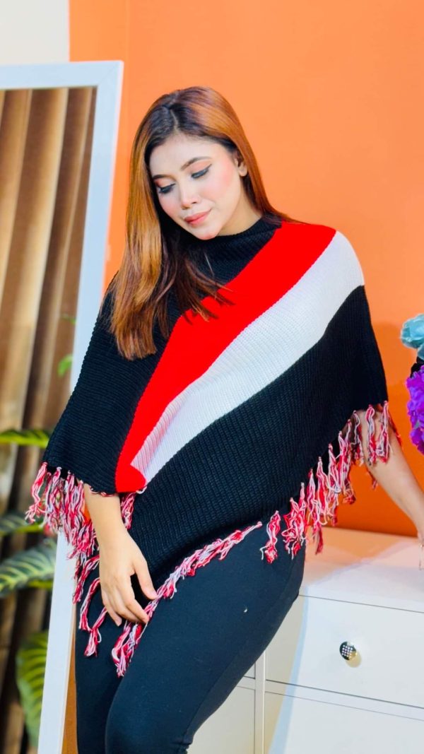 Toropy Premium winter poncho . Latest Designer Clothing for Women's and girl's. No 1 Premium Women's and Girls's Clothing Brand In bangladesh . WOOL Fabrics . Winter Friendly Dress. এই উলের পঞ্চটি শীতের ঠান্ডা থেকে আপনাকে উষ্ণ রাখবে। এর নরম টেক্সচার আপনাকে আরামদায়ক অনুভূতি দেবে। সাধারণ ডিজাইনের এই পঞ্চটি আপনার দৈনন্দিন পোশাকের সাথে সহজেই মানিয়ে নেবে। পঞ্চটি আপনাকে শীতের ফ্যাশন ট্রেন্ডে এগিয়ে রাখবে। এর সুন্দর ডিজাইন আপনাকে বিশেষ করে তুলবে। এই পঞ্চটি শুধু আপনাকে উষ্ণ রাখবে না, আপনার স্টাইলকেও আরও উজ্জ্বল করবে। নরম কাপড় এবং ফ্যাশনেবল ডিজাইন আপনাকে দিনভর আরামদায়ক রাখবে। উষ্ণ, আরামদায়ক, স্টাইলিশ, নরম, হালকা ওজন, দীর্ঘস্থায়ী, ফ্যাশনেবল, ঐতিহ্যবাহী, হাতে বোনা, উল, ক্যাশ্মির, ফ্লিস, এক্রিলিক, শীত, তুষার, ঠান্ডা