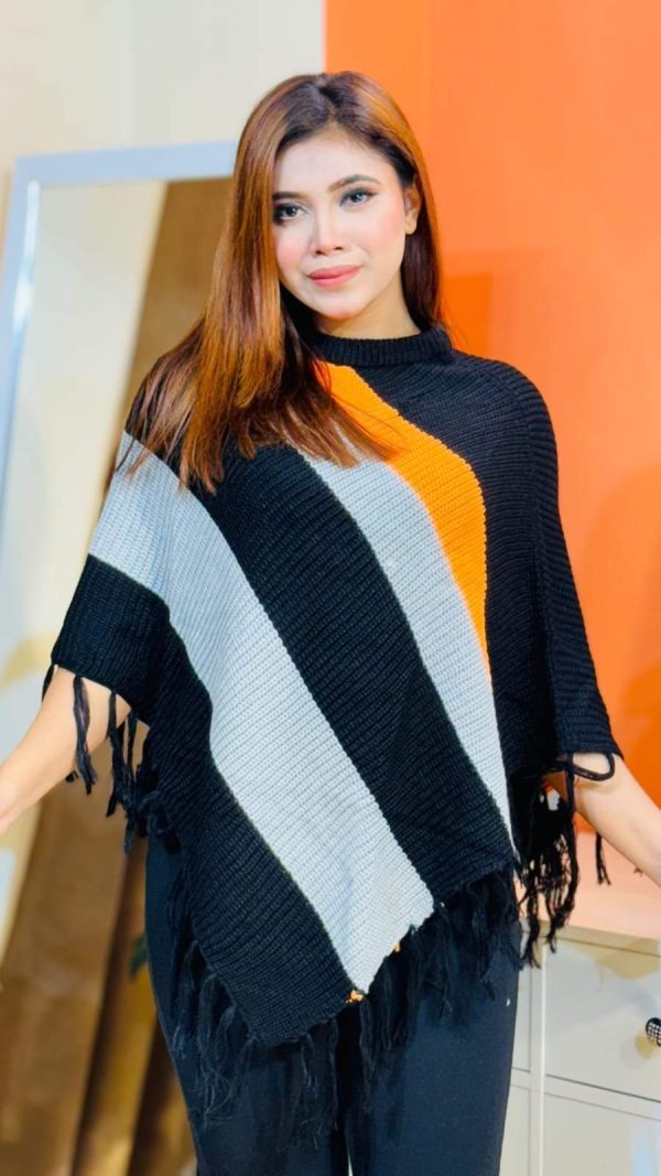 Toropy Premium winter poncho . Latest Designer Clothing for Women's and girl's. No 1 Premium Women's and Girls's Clothing Brand In bangladesh . WOOL Fabrics . Winter Friendly Dress. এই উলের পঞ্চটি শীতের ঠান্ডা থেকে আপনাকে উষ্ণ রাখবে। এর নরম টেক্সচার আপনাকে আরামদায়ক অনুভূতি দেবে। সাধারণ ডিজাইনের এই পঞ্চটি আপনার দৈনন্দিন পোশাকের সাথে সহজেই মানিয়ে নেবে। পঞ্চটি আপনাকে শীতের ফ্যাশন ট্রেন্ডে এগিয়ে রাখবে। এর সুন্দর ডিজাইন আপনাকে বিশেষ করে তুলবে। এই পঞ্চটি শুধু আপনাকে উষ্ণ রাখবে না, আপনার স্টাইলকেও আরও উজ্জ্বল করবে। নরম কাপড় এবং ফ্যাশনেবল ডিজাইন আপনাকে দিনভর আরামদায়ক রাখবে। উষ্ণ, আরামদায়ক, স্টাইলিশ, নরম, হালকা ওজন, দীর্ঘস্থায়ী, ফ্যাশনেবল, ঐতিহ্যবাহী, হাতে বোনা, উল, ক্যাশ্মির, ফ্লিস, এক্রিলিক, শীত, তুষার, ঠান্ডা