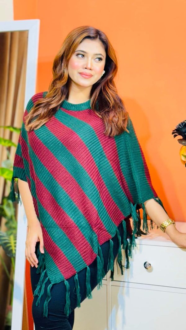 Toropy Premium winter poncho . Latest Designer Clothing for Women's and girl's. No 1 Premium Women's and Girls's Clothing Brand In bangladesh . WOOL Fabrics . Winter Friendly Dress. এই উলের পঞ্চটি শীতের ঠান্ডা থেকে আপনাকে উষ্ণ রাখবে। এর নরম টেক্সচার আপনাকে আরামদায়ক অনুভূতি দেবে। সাধারণ ডিজাইনের এই পঞ্চটি আপনার দৈনন্দিন পোশাকের সাথে সহজেই মানিয়ে নেবে। পঞ্চটি আপনাকে শীতের ফ্যাশন ট্রেন্ডে এগিয়ে রাখবে। এর সুন্দর ডিজাইন আপনাকে বিশেষ করে তুলবে। এই পঞ্চটি শুধু আপনাকে উষ্ণ রাখবে না, আপনার স্টাইলকেও আরও উজ্জ্বল করবে। নরম কাপড় এবং ফ্যাশনেবল ডিজাইন আপনাকে দিনভর আরামদায়ক রাখবে। উষ্ণ, আরামদায়ক, স্টাইলিশ, নরম, হালকা ওজন, দীর্ঘস্থায়ী, ফ্যাশনেবল, ঐতিহ্যবাহী, হাতে বোনা, উল, ক্যাশ্মির, ফ্লিস, এক্রিলিক, শীত, তুষার, ঠান্ডা