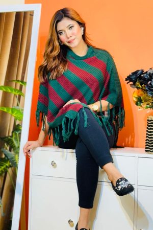 Toropy Premium winter poncho . Latest Designer Clothing for Women's and girl's. No 1 Premium Women's and Girls's Clothing Brand In bangladesh . WOOL Fabrics . Winter Friendly Dress. এই উলের পঞ্চটি শীতের ঠান্ডা থেকে আপনাকে উষ্ণ রাখবে। এর নরম টেক্সচার আপনাকে আরামদায়ক অনুভূতি দেবে। সাধারণ ডিজাইনের এই পঞ্চটি আপনার দৈনন্দিন পোশাকের সাথে সহজেই মানিয়ে নেবে। পঞ্চটি আপনাকে শীতের ফ্যাশন ট্রেন্ডে এগিয়ে রাখবে। এর সুন্দর ডিজাইন আপনাকে বিশেষ করে তুলবে। এই পঞ্চটি শুধু আপনাকে উষ্ণ রাখবে না, আপনার স্টাইলকেও আরও উজ্জ্বল করবে। নরম কাপড় এবং ফ্যাশনেবল ডিজাইন আপনাকে দিনভর আরামদায়ক রাখবে। উষ্ণ, আরামদায়ক, স্টাইলিশ, নরম, হালকা ওজন, দীর্ঘস্থায়ী, ফ্যাশনেবল, ঐতিহ্যবাহী, হাতে বোনা, উল, ক্যাশ্মির, ফ্লিস, এক্রিলিক, শীত, তুষার, ঠান্ডা