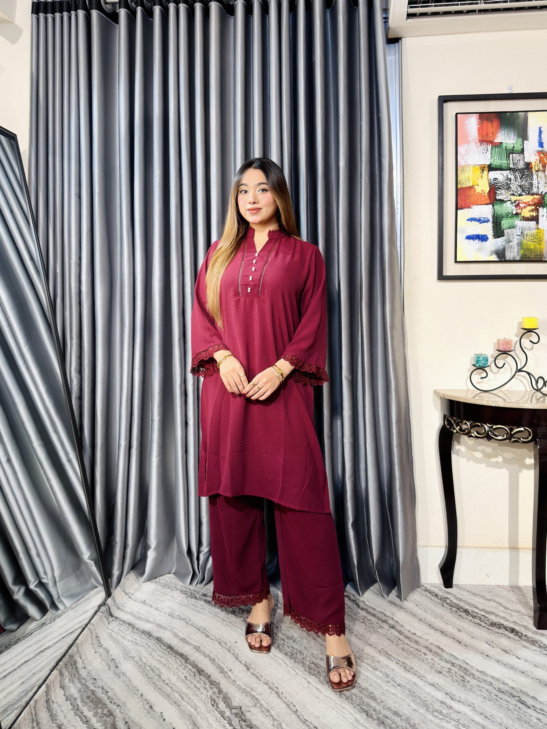 Women wearing elegant burgundy two piece kurti and palazzo set from Toropy ladies collection