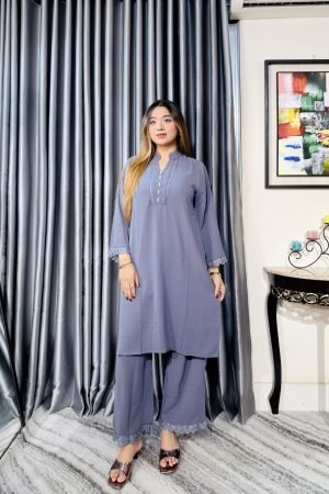 Women wearing elegant grey two piece kurti and palazzo set from Toropy ladies collection