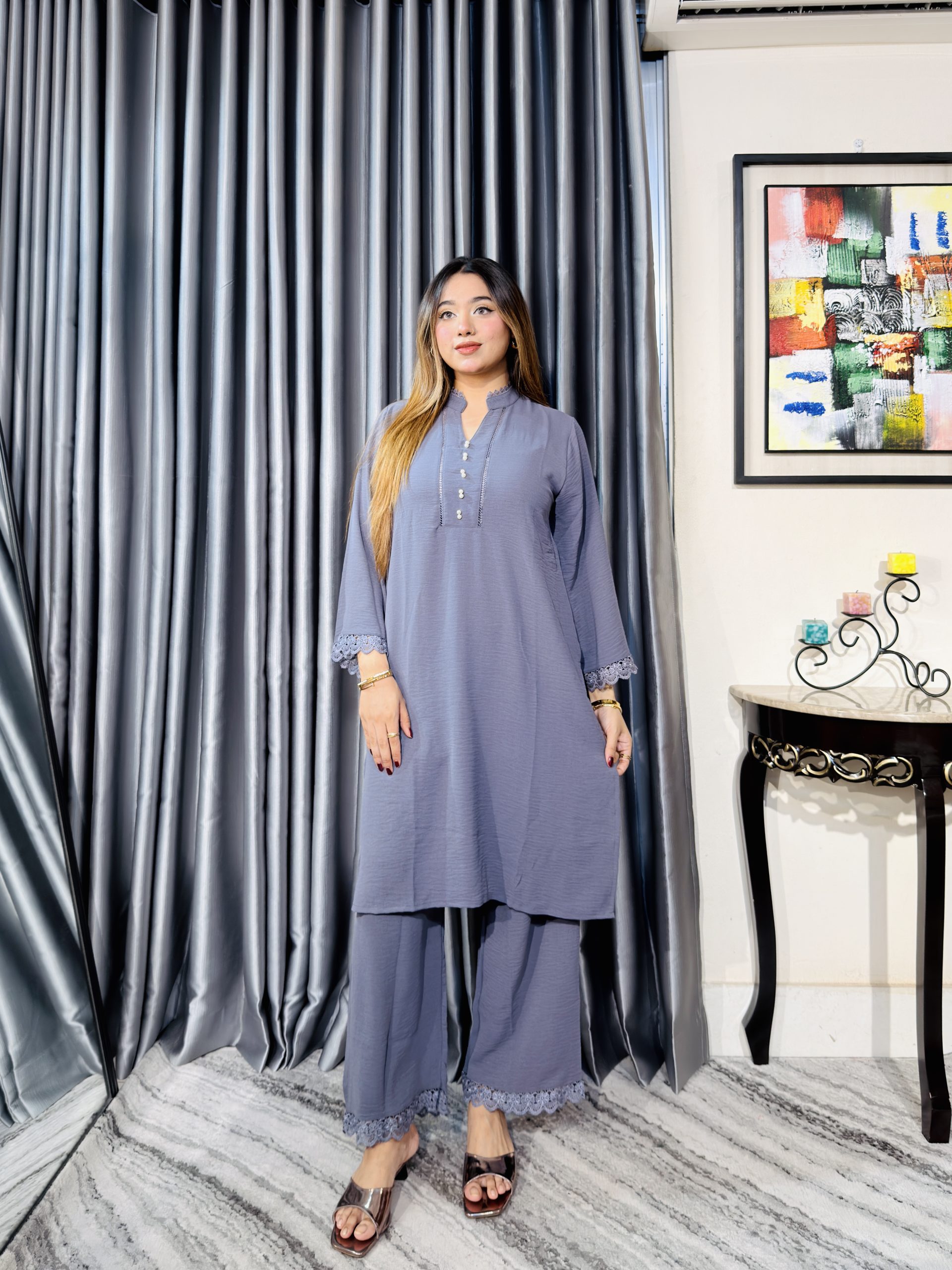 Women wearing elegant grey two piece kurti and palazzo set from Toropy ladies collection
